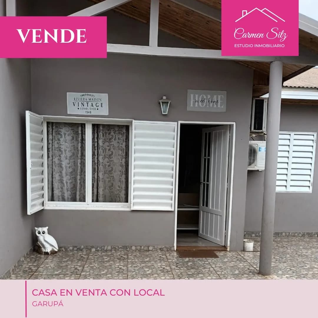 Fachada de casa gris en venta