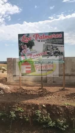 Cartel publicitario de venta de lotes