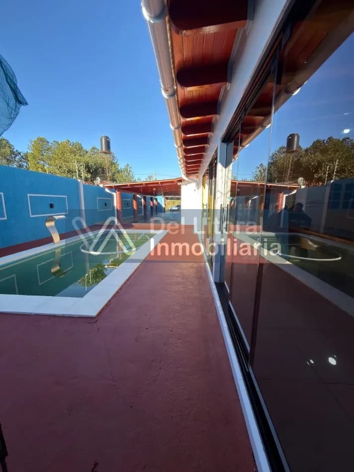 TERRENO CON CASA, QUINCHO Y PILETA